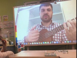 George Gibson playing guitar on computer screen